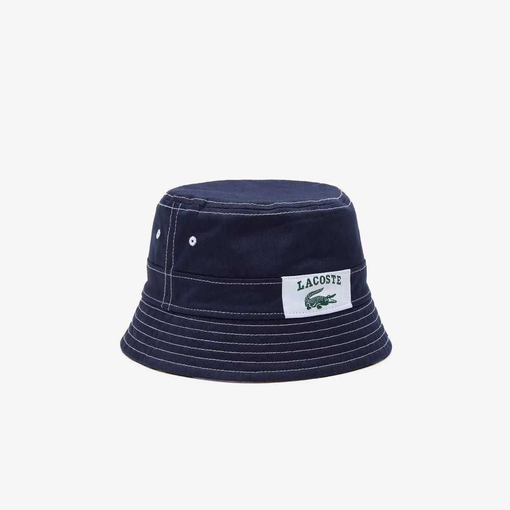 Lacoste Heritage Reversible Print Or Solid Cotton Bucket Hat Navy Blue / White | SLG-314086